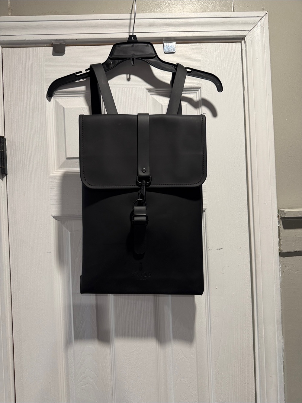 Rains Black Rolltop Backpack with Front Buckle